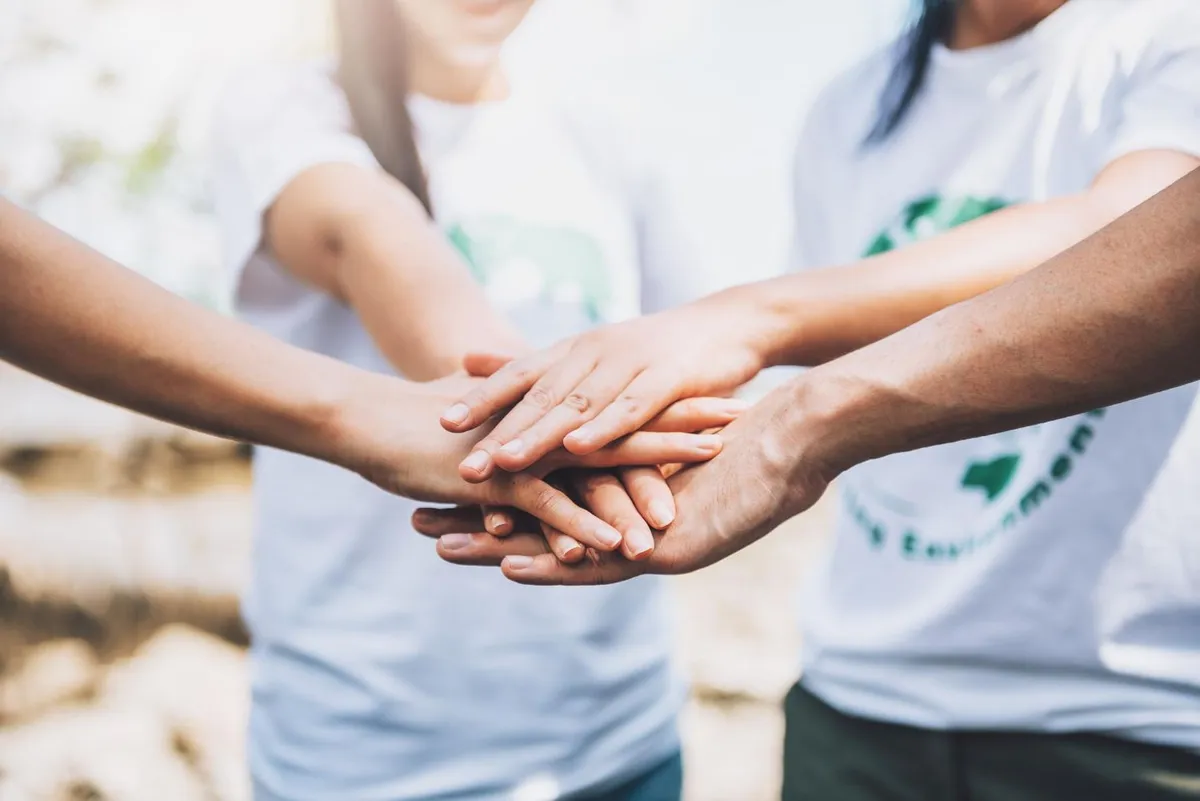 Charity volunteers working together in a community project