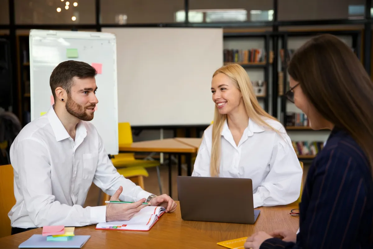 Recruitment consultants meeting with candidates across a desk